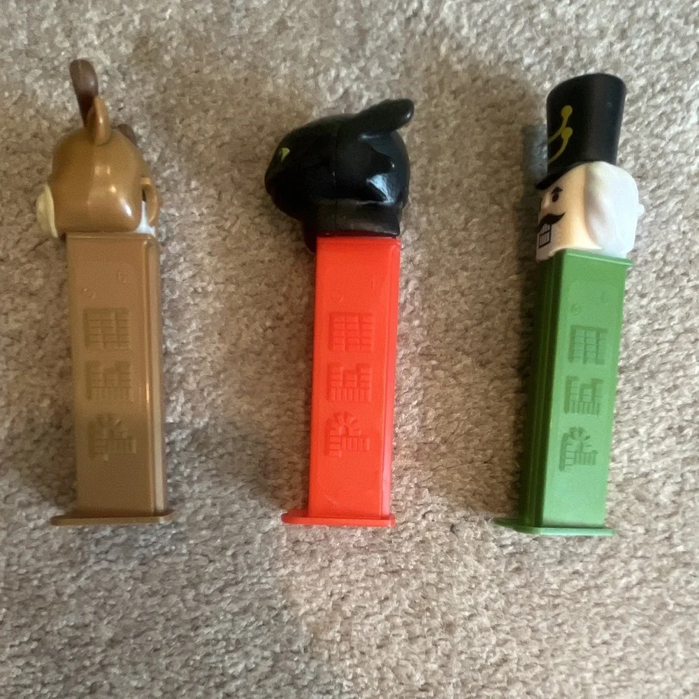 Lot of 3 PEZ Candy Dispensers: Reindeer, Black Beast/Monster & Nutcracker